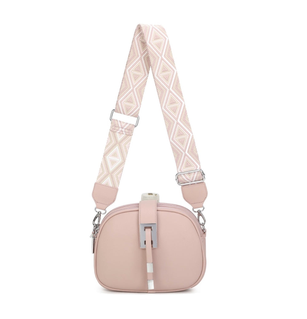     Pink crossbody bag with wide patterned adjustable strap