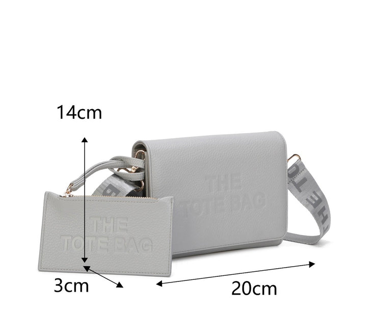 Gray handbag with measurements indicated 