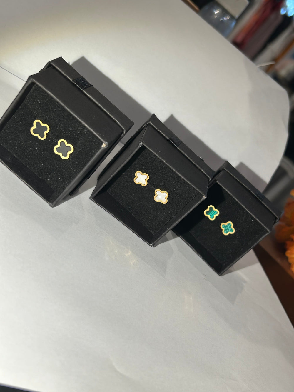 Black green and white clover shaped gold earrings 