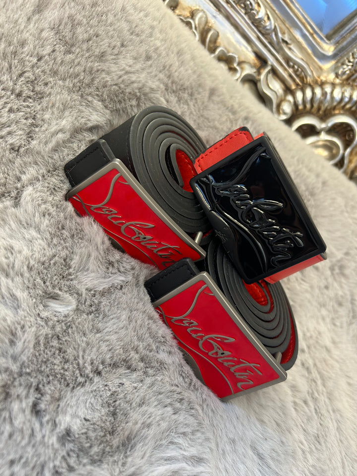 Two belts with red and black colour scheme one with black buckle