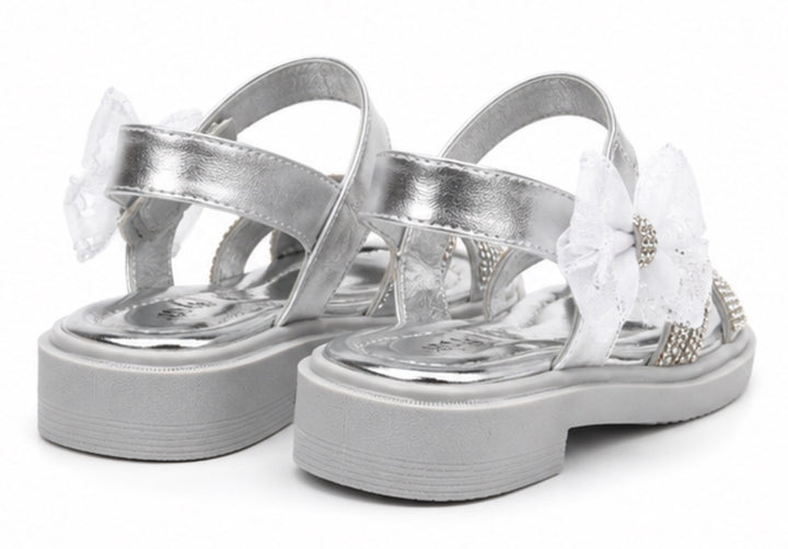 Silver girls’ sandals with sparkling diamanté crossover straps, oversized glitter mesh bow detail 