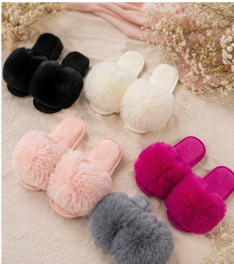 Girls fluffy pom pom slide slippers available in hot pink, grey, blush pink, black and cream colours.