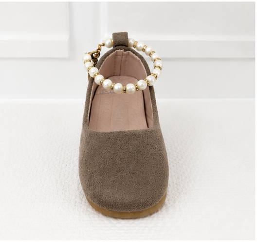 Girls taupe ballet flat shoes with pearl ankle bracelet strap, gold charm detail and soft suede-effect finish.