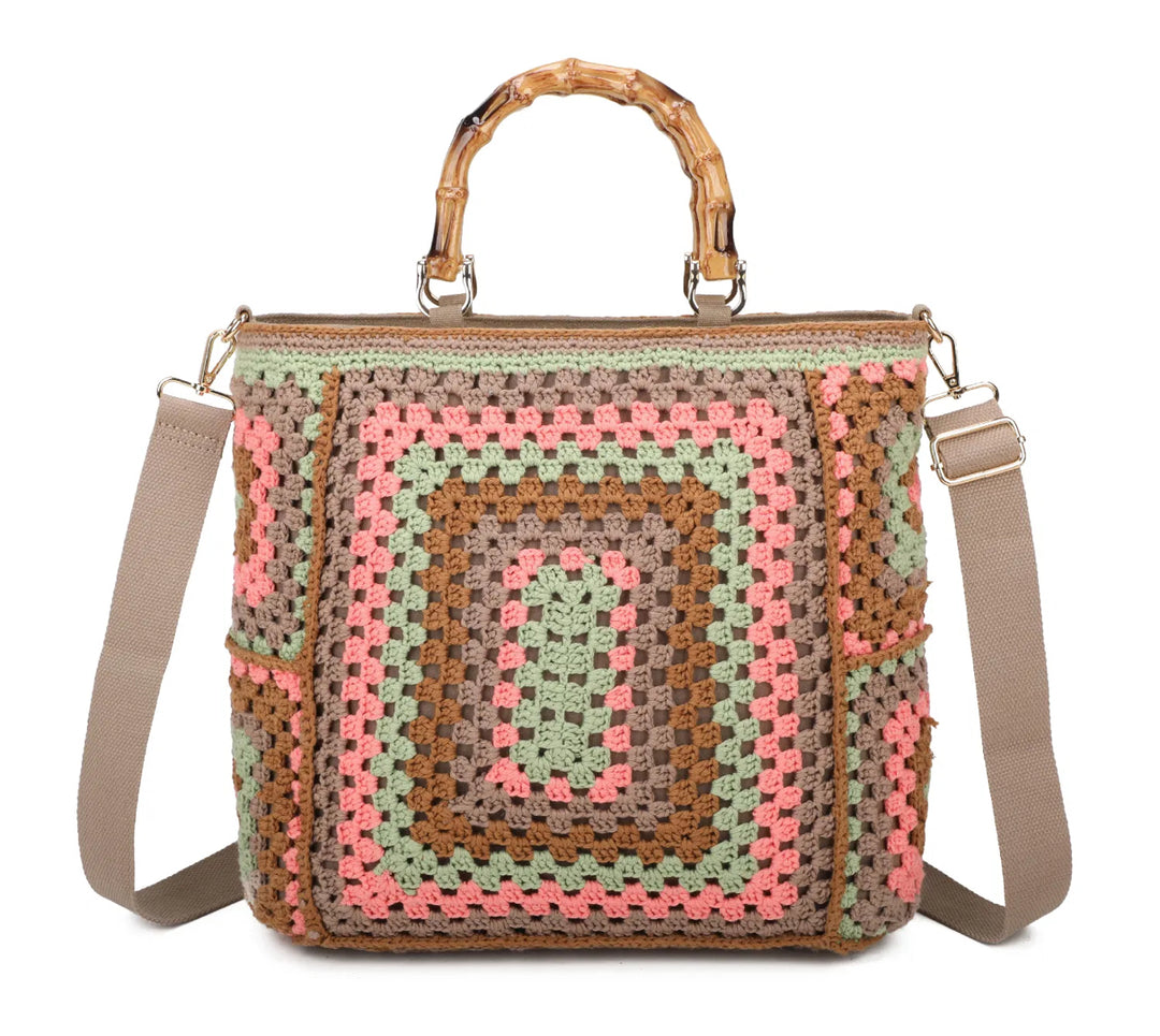 Beige based crochet grab bags with bamboo handles and a top zip closure
