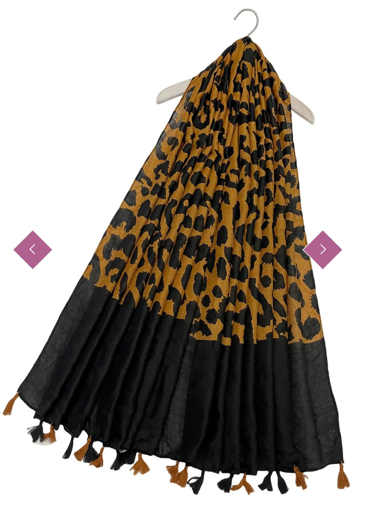 Black and yellow/ mustard leopard print design scarf with matching colour tassels 