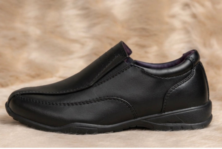 Boys black smart shoes with smooth leather-look finish and comfortable low wedge sole.