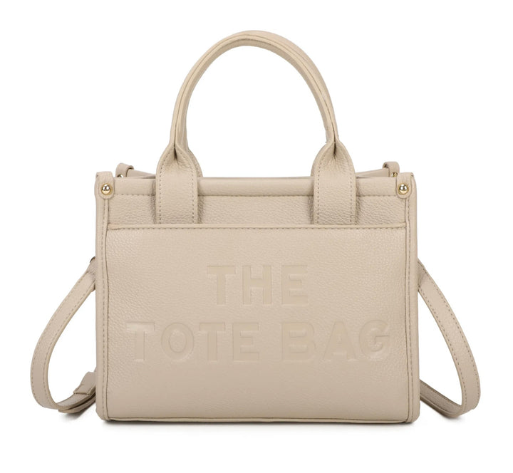 A beige tote bag with the text &