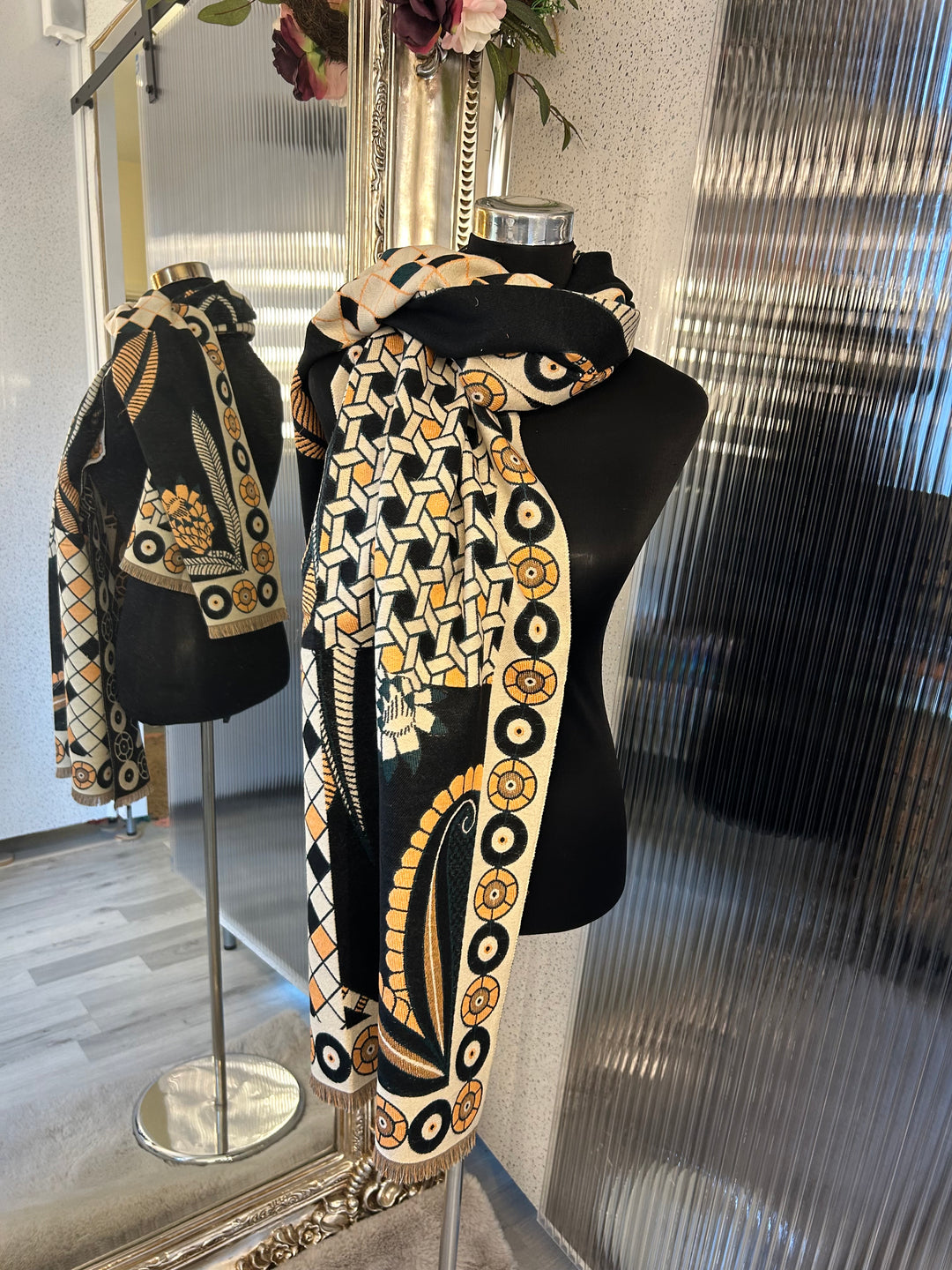 Black geometric scarf with beige and orange accent
