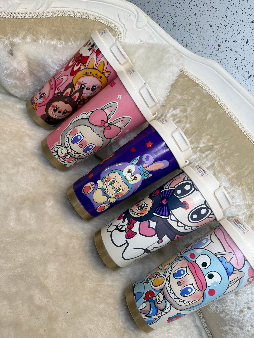 colourful cartoon travel cups featuring cute character designs