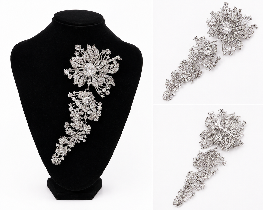 Silver crystal cascading floral statement brooch with large flower and sparkling drop detail