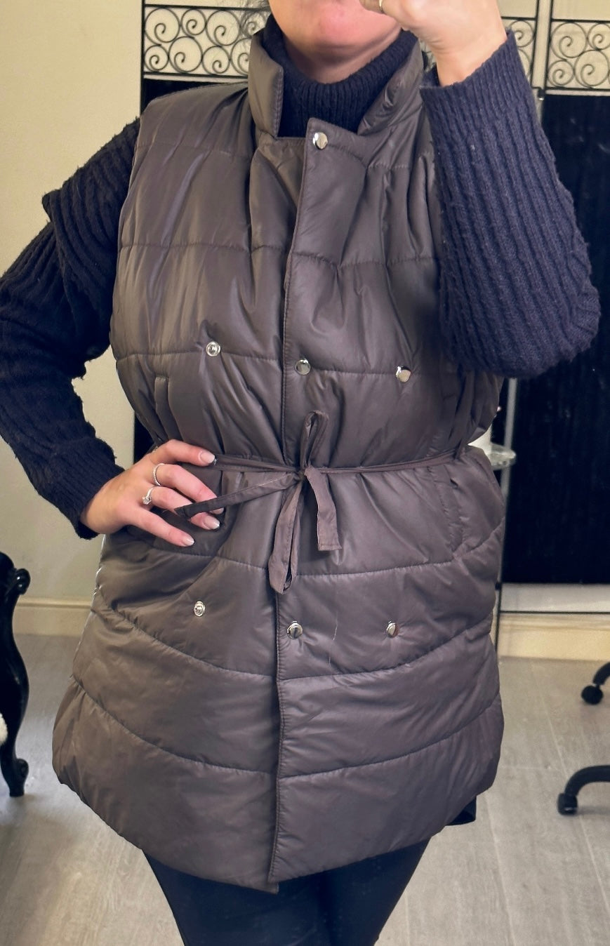  mid-length gilet, one in brown with ribbon belt