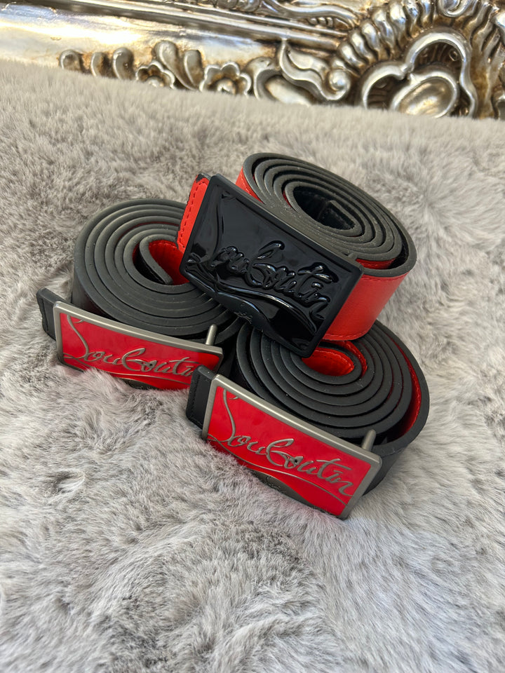 Two belts with red and black colour scheme one with black buckle