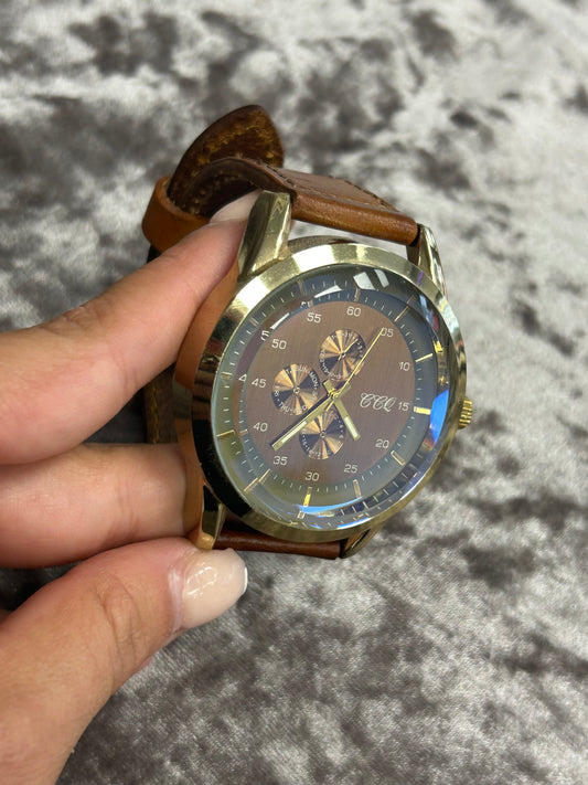 Gold and brown men’s watch