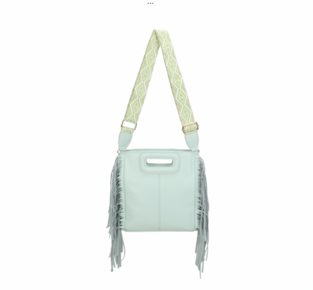 Mint green handbag with fringe details and a patterned strap 