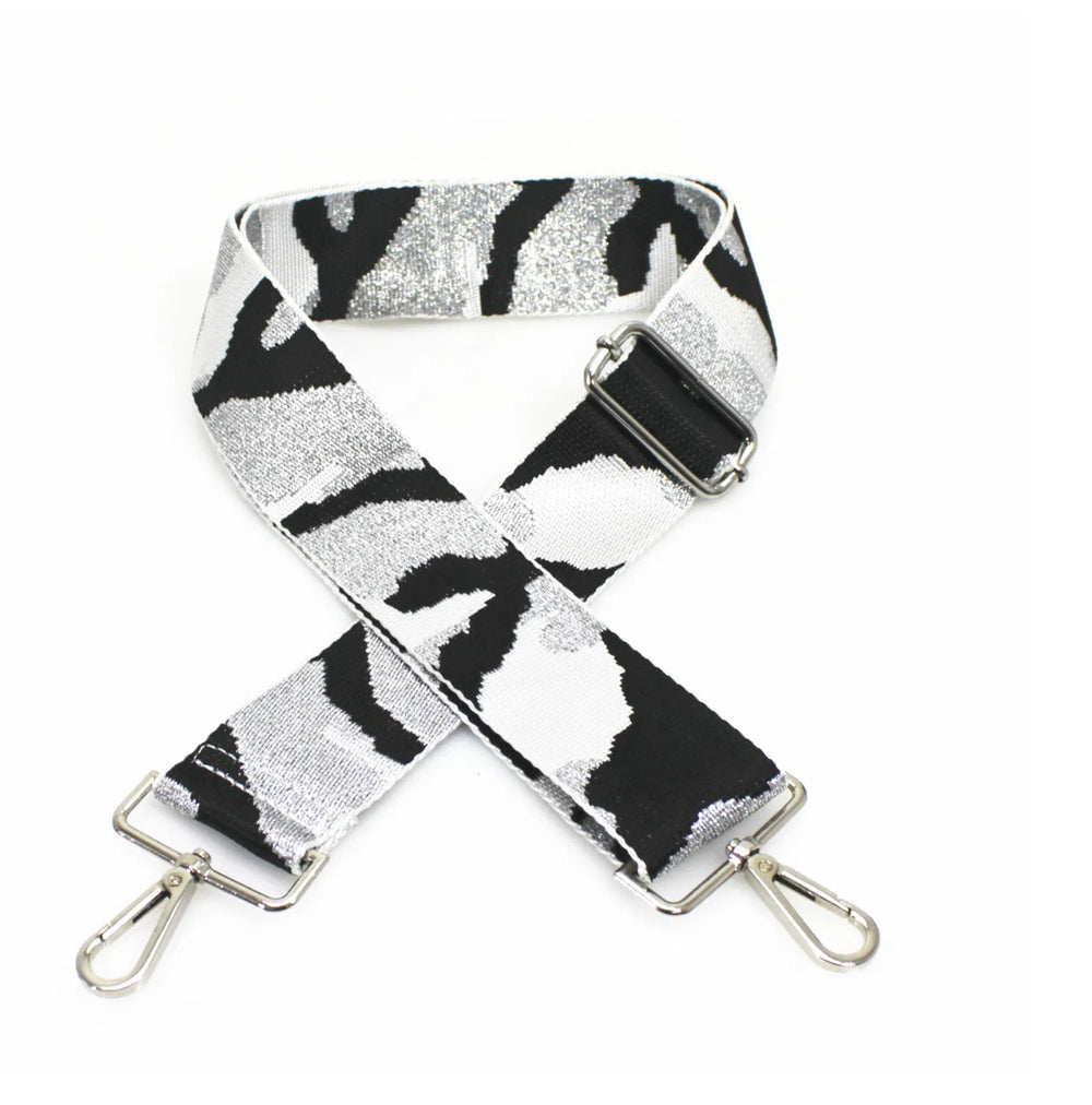 adjustable woven handbag straps featuring a white and metallic silver zebra pattern with silver hardware 