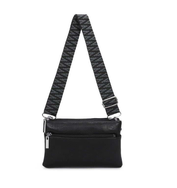 multi pocket crossbody bag with patterned adjustable shoulder strap and silver hardware.