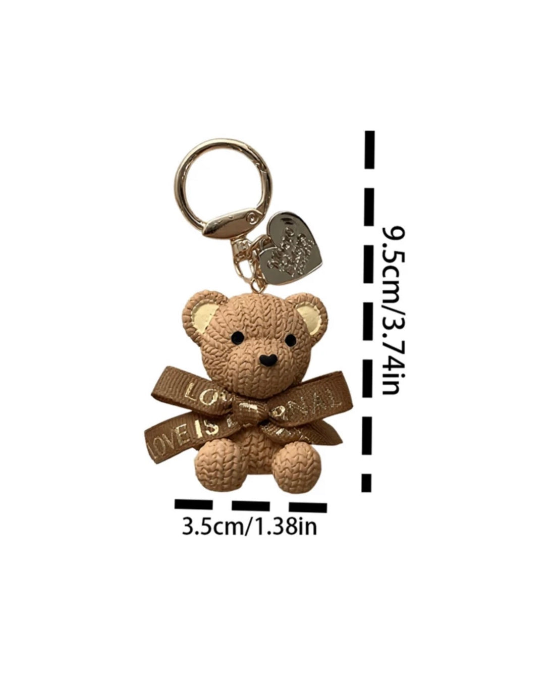     Beige teddy bear keyring charm with ribbon bow and gold heart pendant.