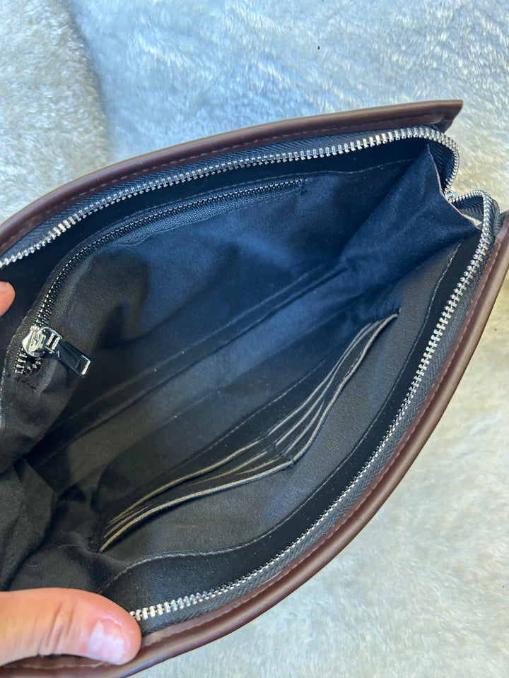 An open Checkered wallet clutch bag with a brown and black pattern 