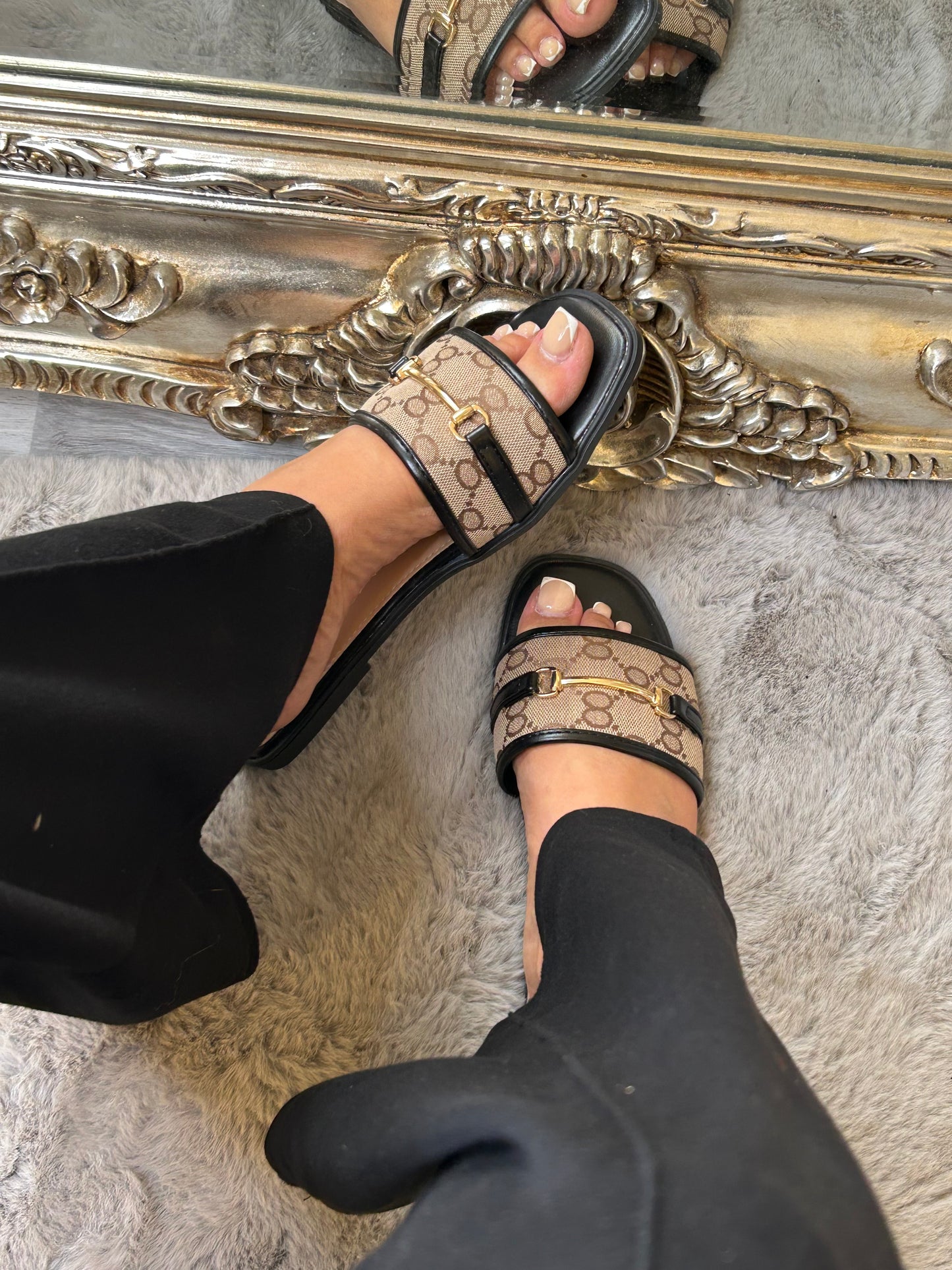 Beige and black sliders with chain detail
