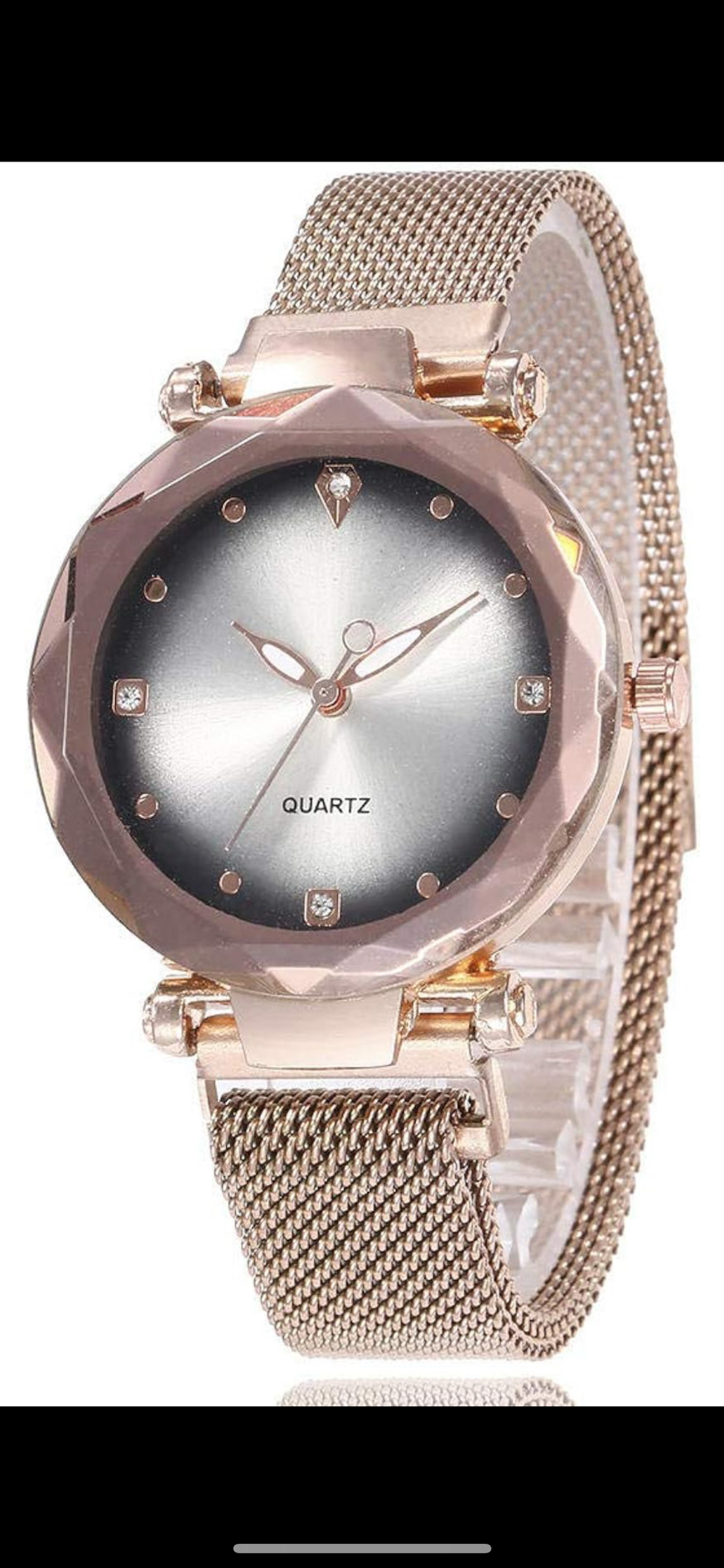 A rose gold wristwatch with a glitter face with a magnetic closure strap