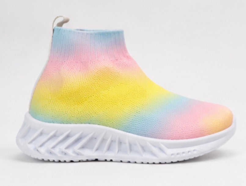 Children’s rainbow slip-on trainers with soft sock-style fit and chunky white grip sole