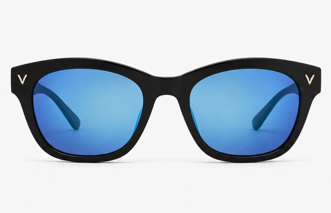 Black oversized sunglasses with glossy black frames, blue mirrored lenses and gold V detail