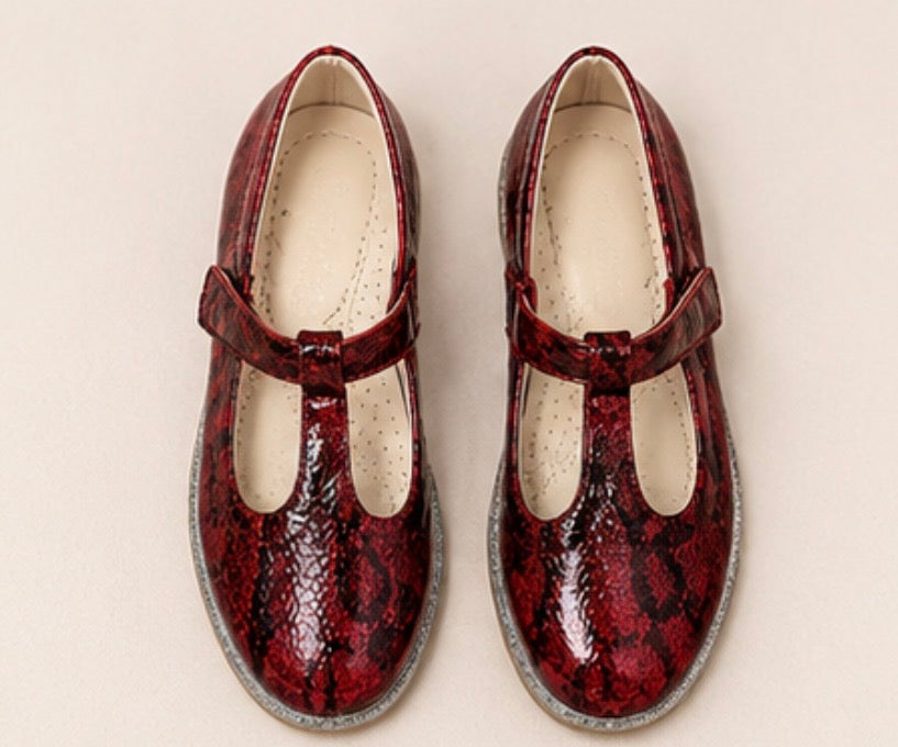 Red snakeskin-effect occasional shoes with glitter sole detail and fastening strap.