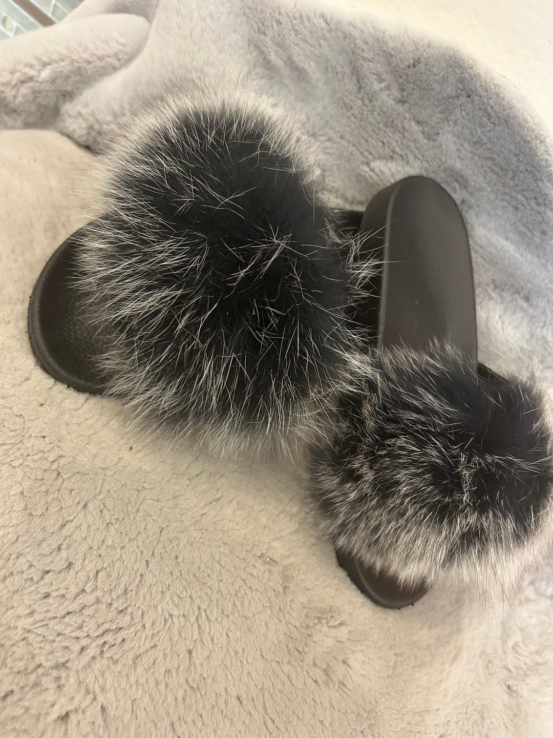 Grey fur sliders with black sole 