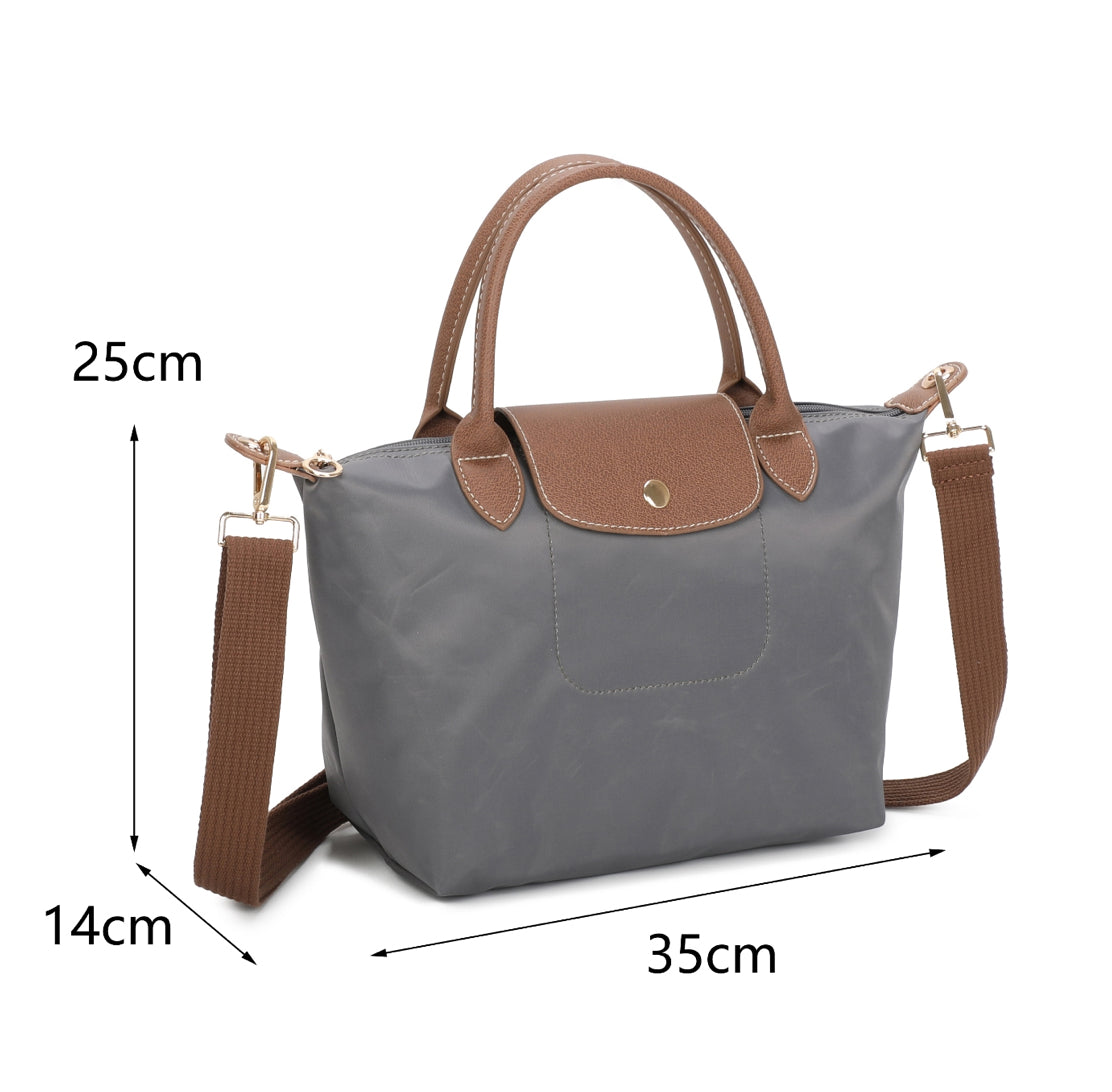 Grey handbag with brown handles and strap 