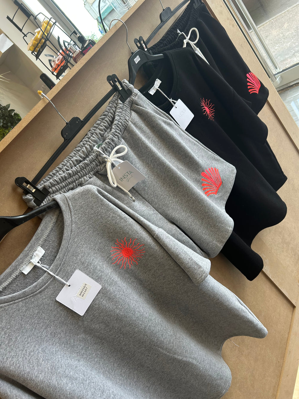 Grey and black short set with a sun detail 