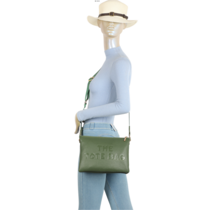 Mannequin wearing a green bag with &