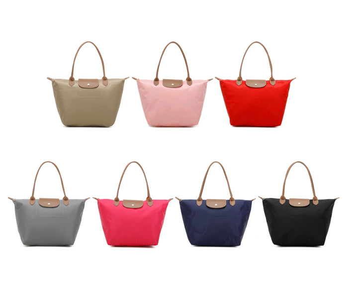 Collection of foldable tote handbags in assorted colours, each with brown handles and a snap flap closure. 