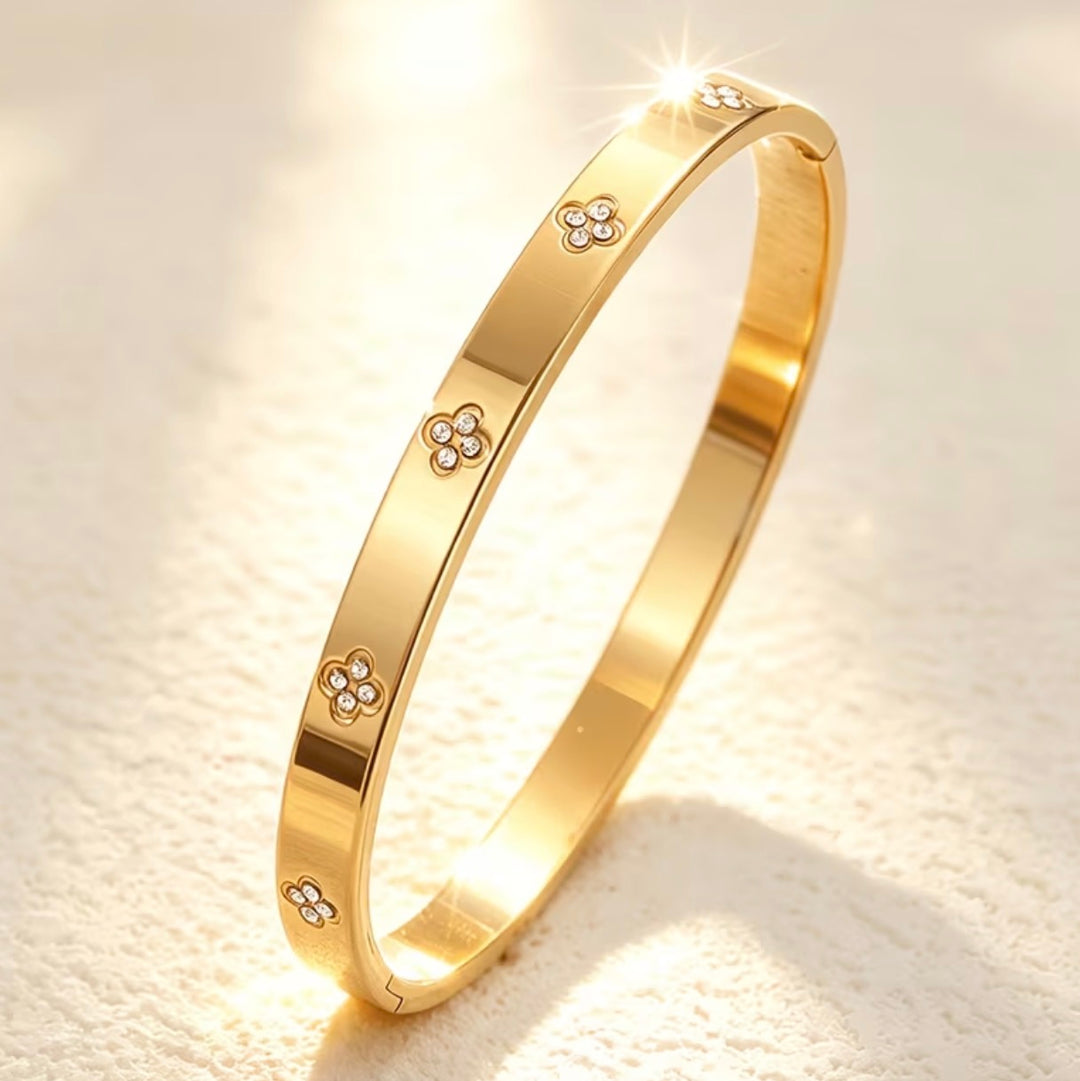 Gold bracelet with floral designs
