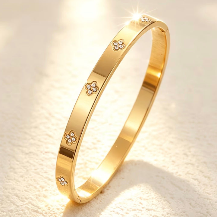 Gold bracelet with floral designs
