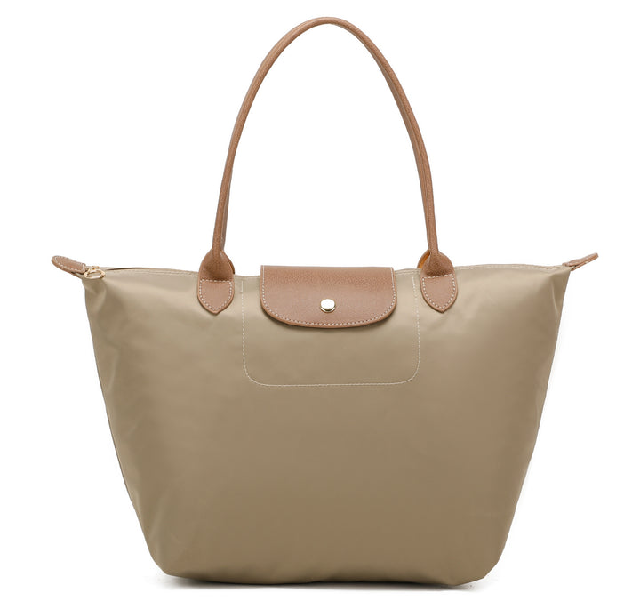 Beige handbag with brown handles and trim