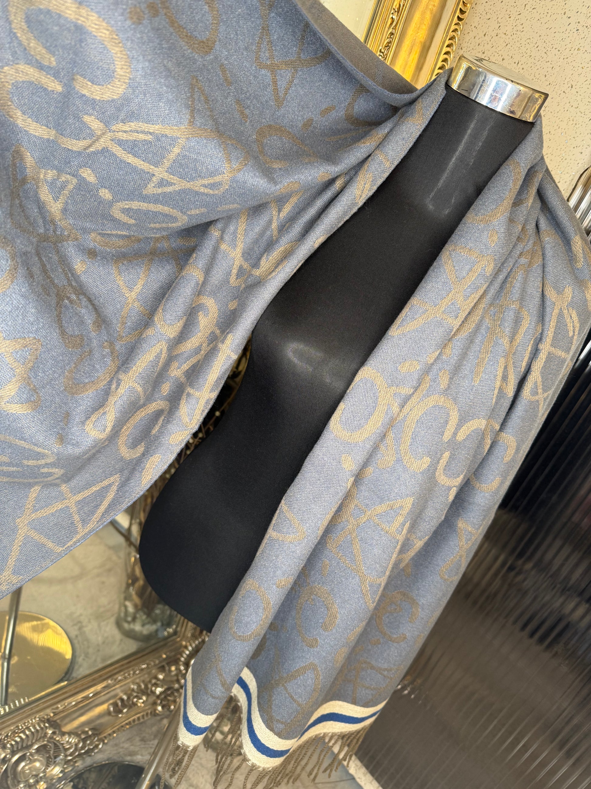 Blue scarf with stripe detail and tassel 