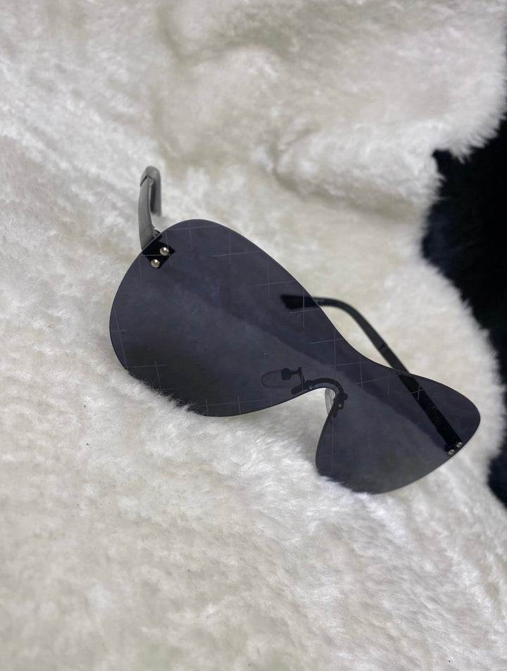 A pair of black cross design sunglasses