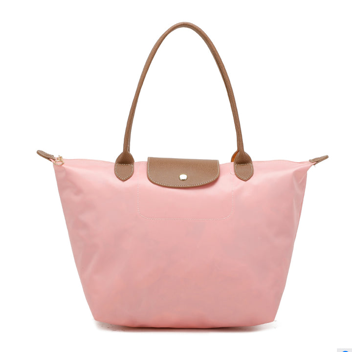 Pink handbag with brown handles and outlined 