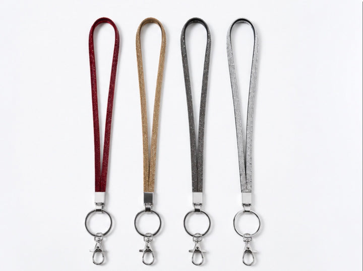 Crystal sparkle lanyards in red, gold, grey and silver with silver-tone keyring and clasp attachments.