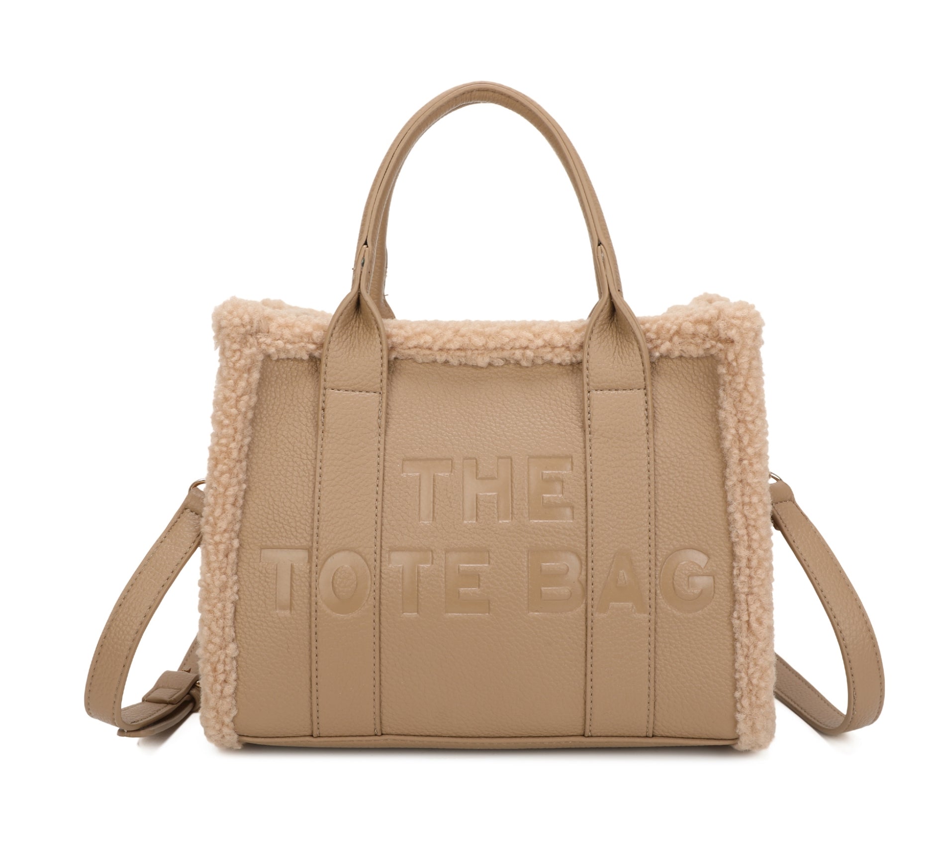 Tote bags with fuzzy edge trim, embossed with ‘The Tote Bag’ on the front in beige 