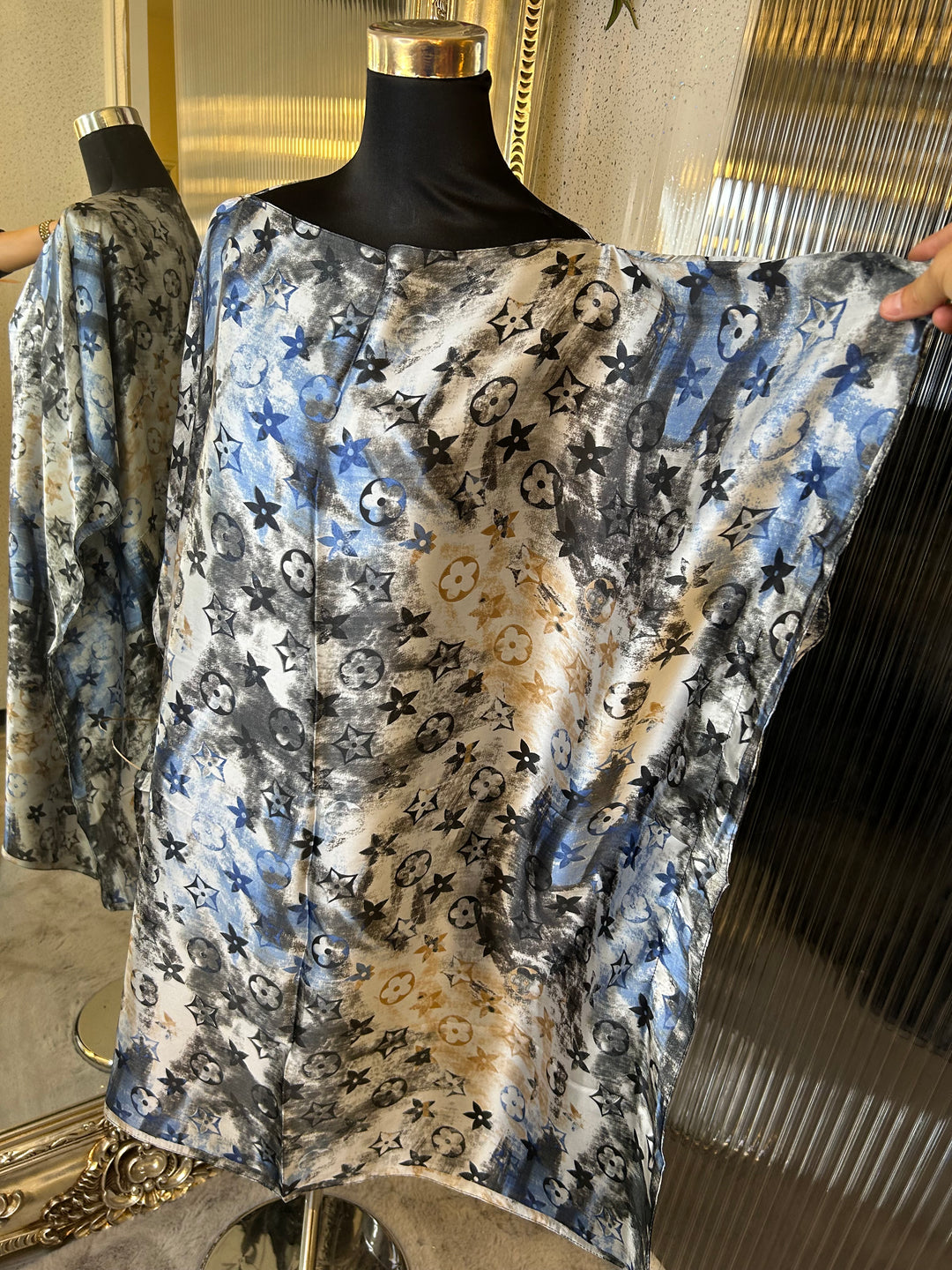 Close-up of a patterned fabric with blue and black design