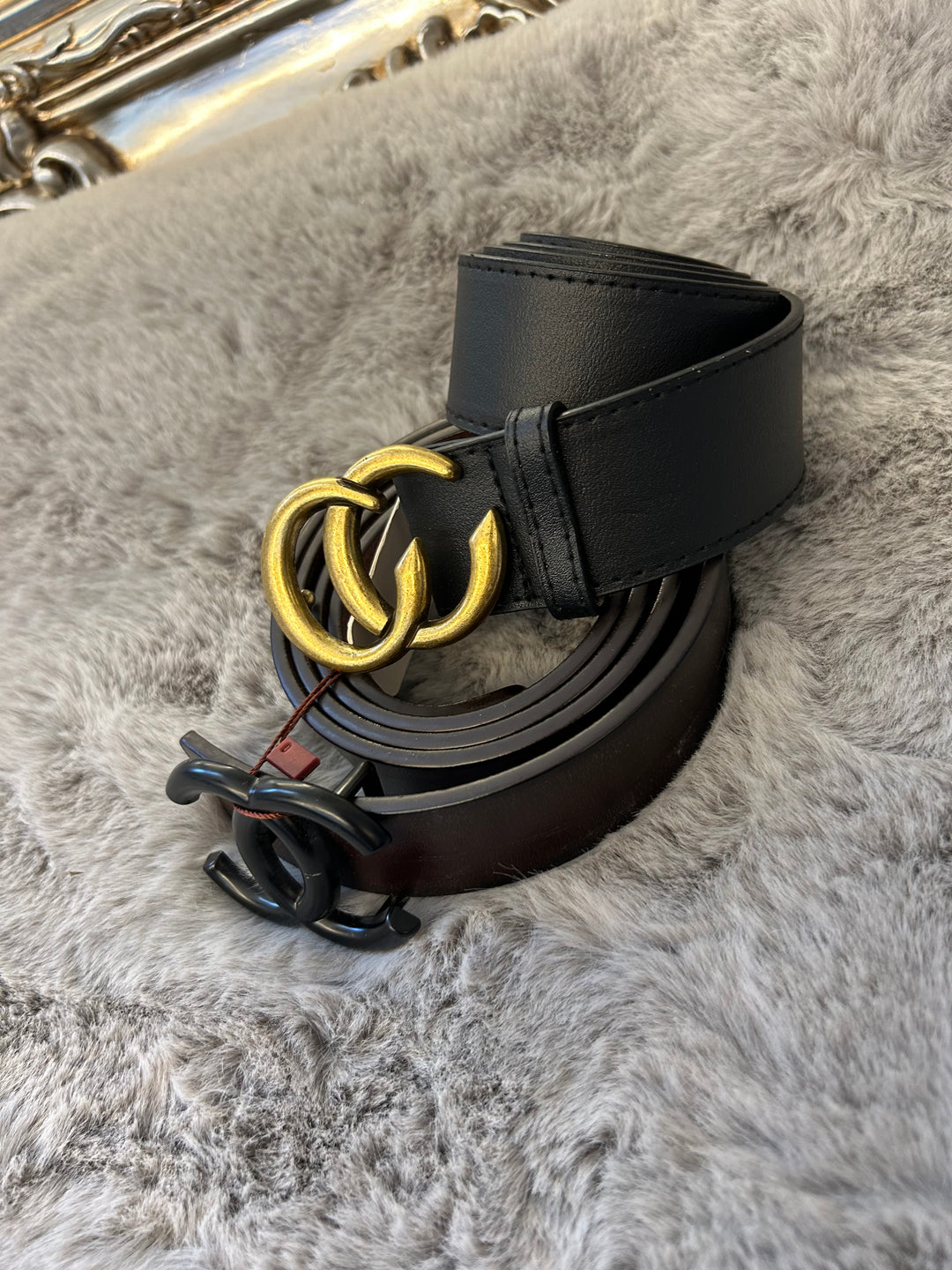 A belt with a gold-coloured buckle faux leather material