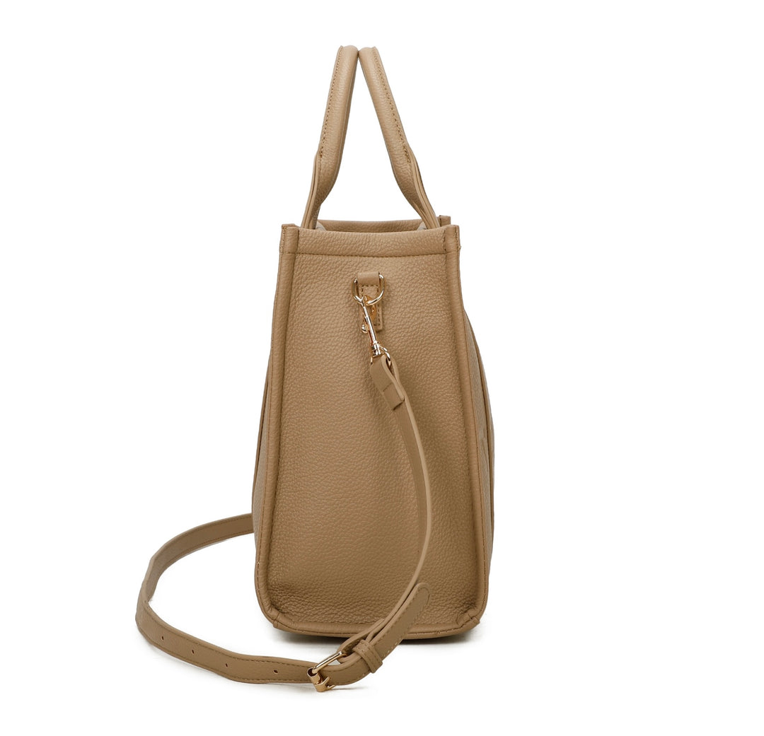 A beige tote bag with embossed ‘The Tote Bag’ text, structured design with top handles and detachable shoulder strap