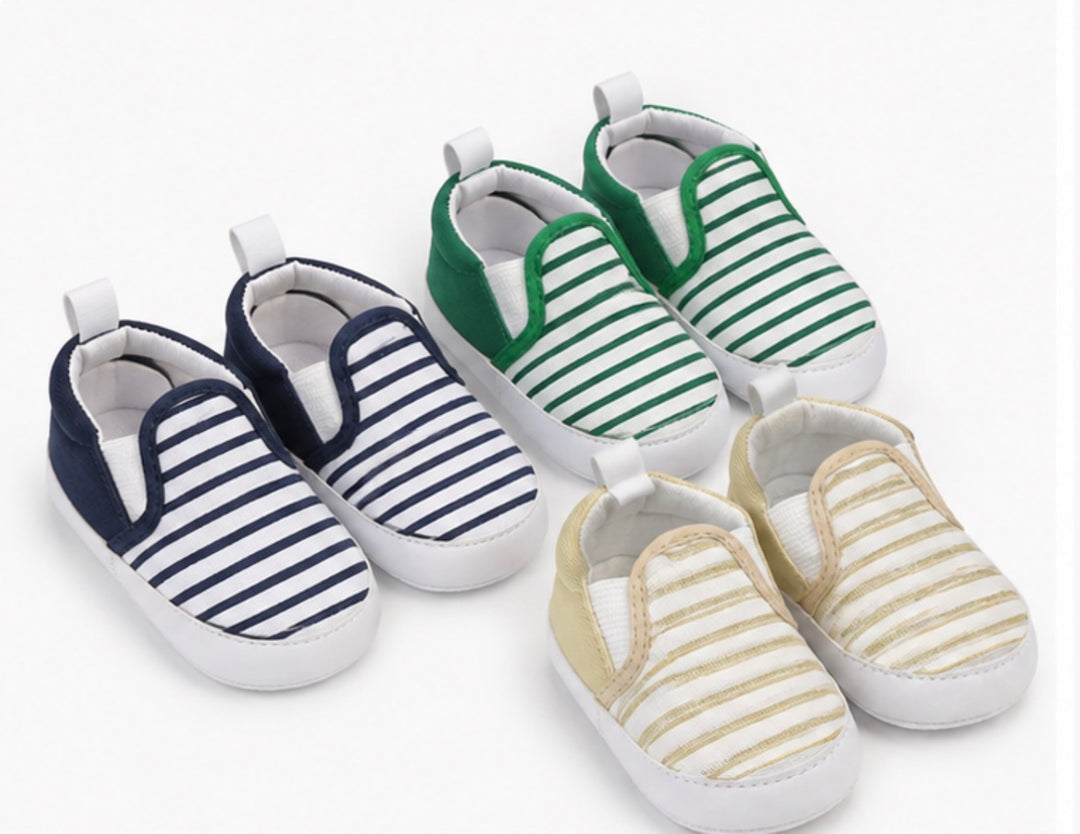 Soft baby crib shoes with striped pattern and flexible non-slip white sole 