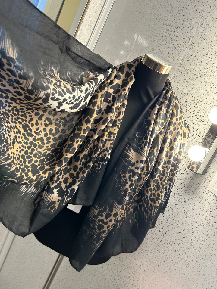 A leopard print thin scarf with a black border