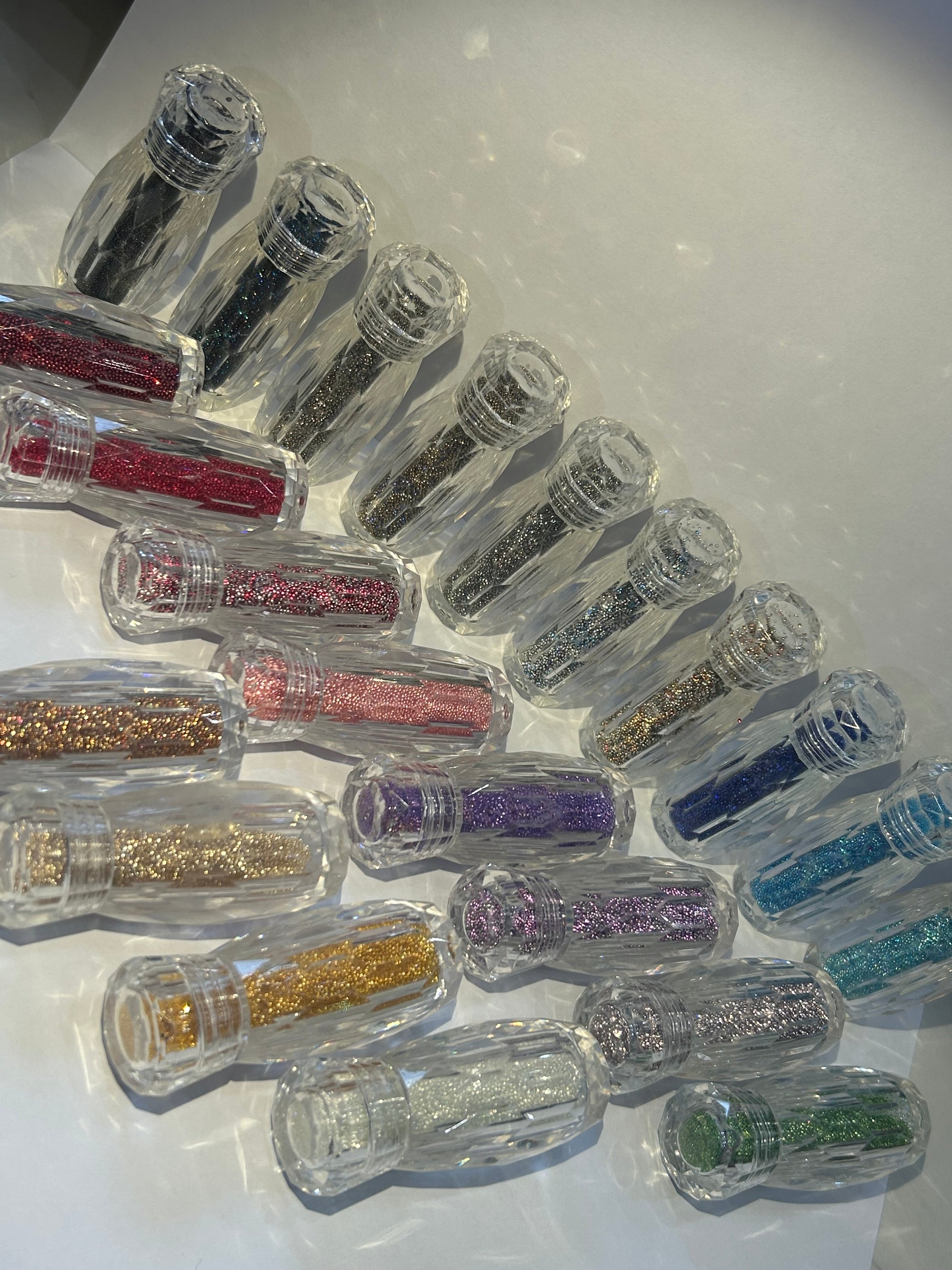 Micro caviar pixie crystals in clear bottles 