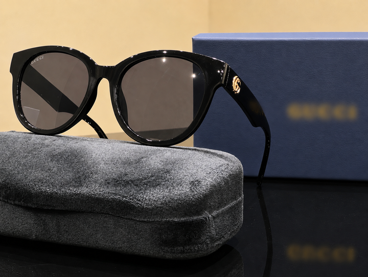 Simple black unisex sunglasses with gold detail 