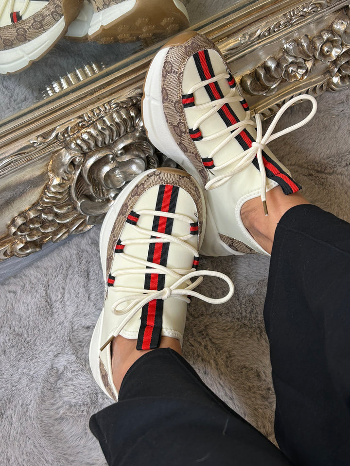 Stripe down the centre of cream beige trainers 