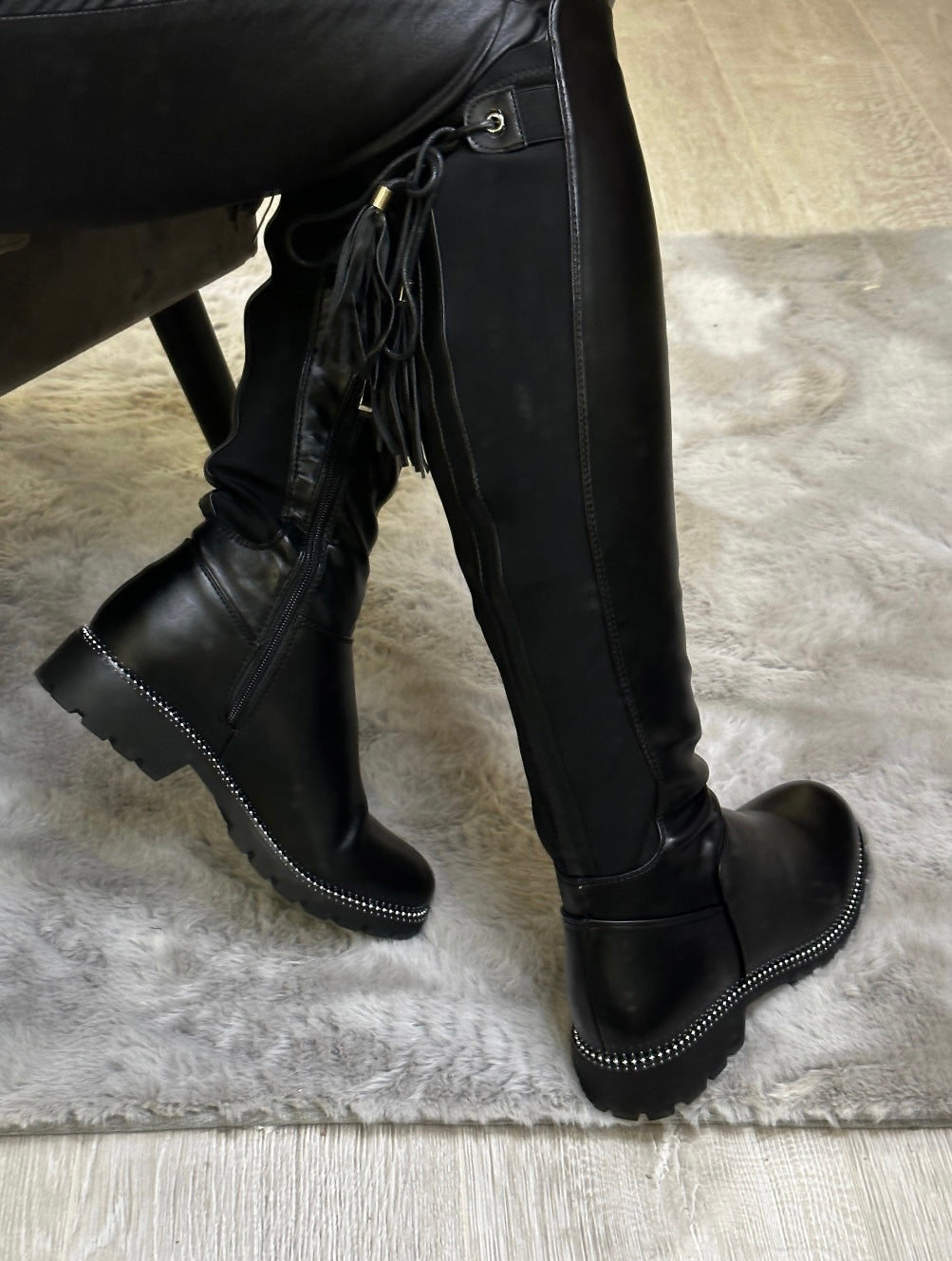 Knee high black boots with tassel