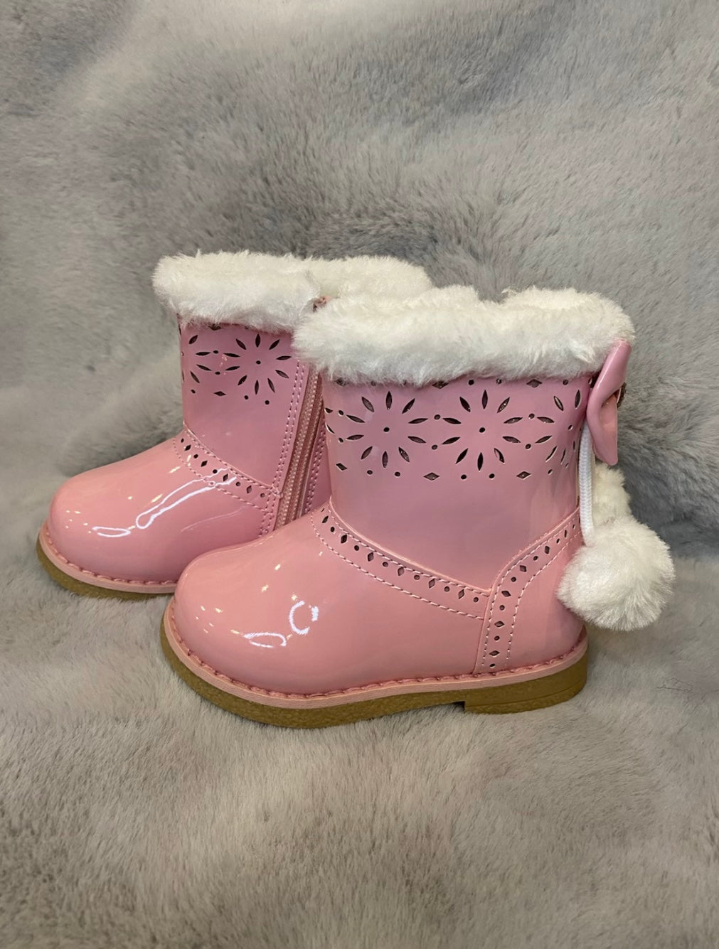 Pink girl boots with bow detail on the back